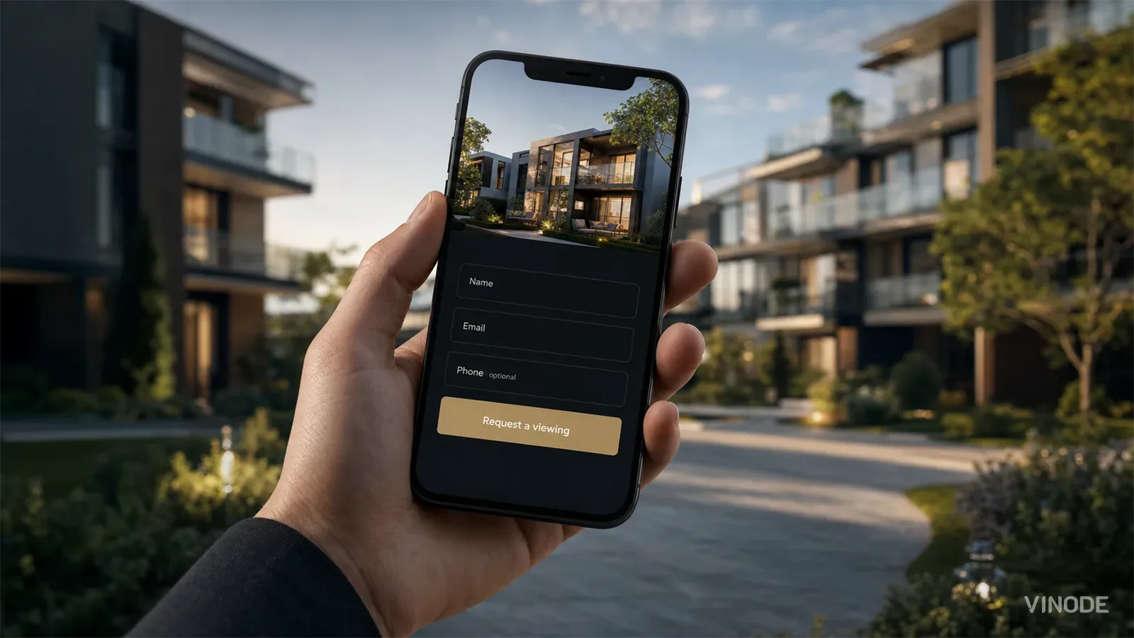 Hand holding a phone showing a property lead capture form