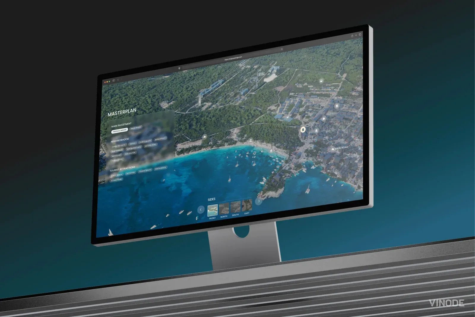 Desktop monitor showing an interactive aerial masterplan interface for a beachfront development